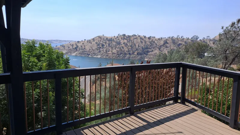 The deck railing looking out over Millerton Lake at the residential property
