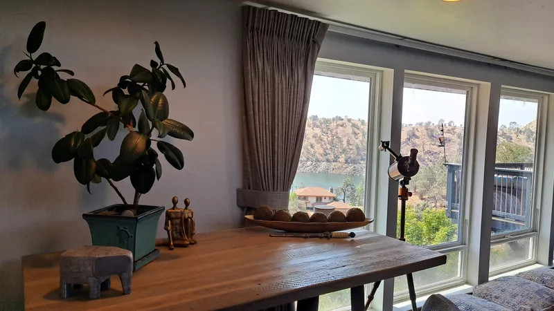 The dining table by the window at the residence